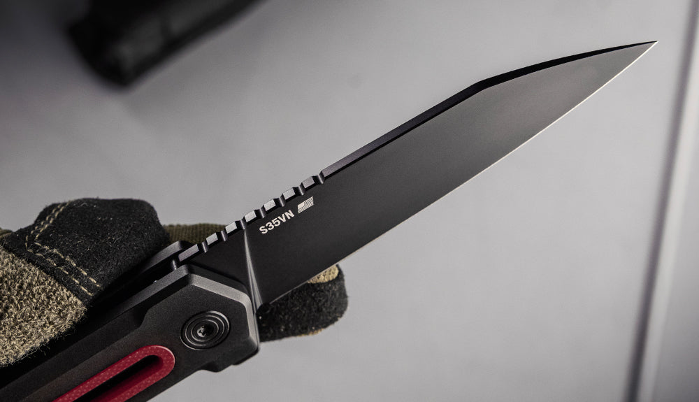 TEKTO fixed blade and folding knives laid out on a workbench