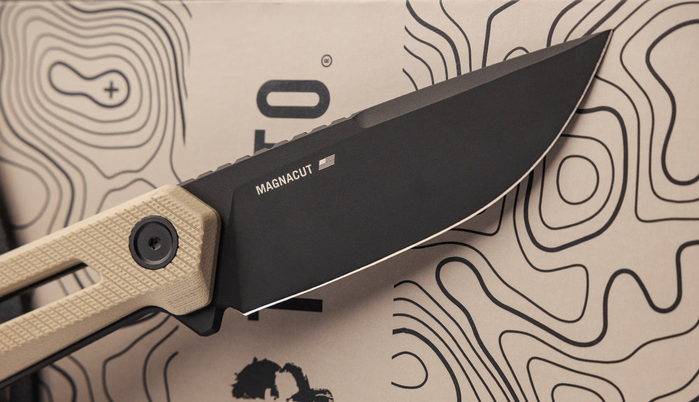 TEKTO X1 Atlas fixed blade with a desert G10 handle resting on a topographic map