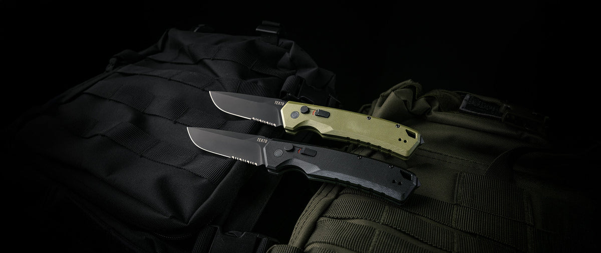 Two A3 Delta automatic knives in black and OD green G10 on dark gear