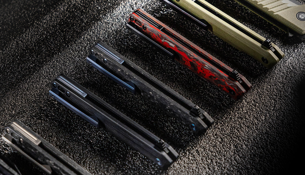 A collection of TEKTO F2 Bravo folding knife handles with titanium accents