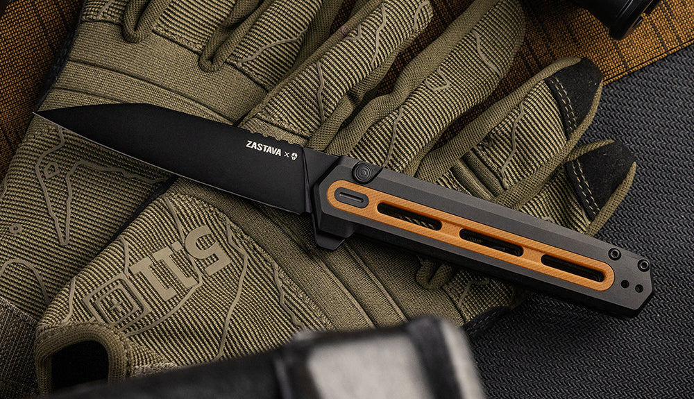 F4 Echo folding knife placed on top of work gloves
