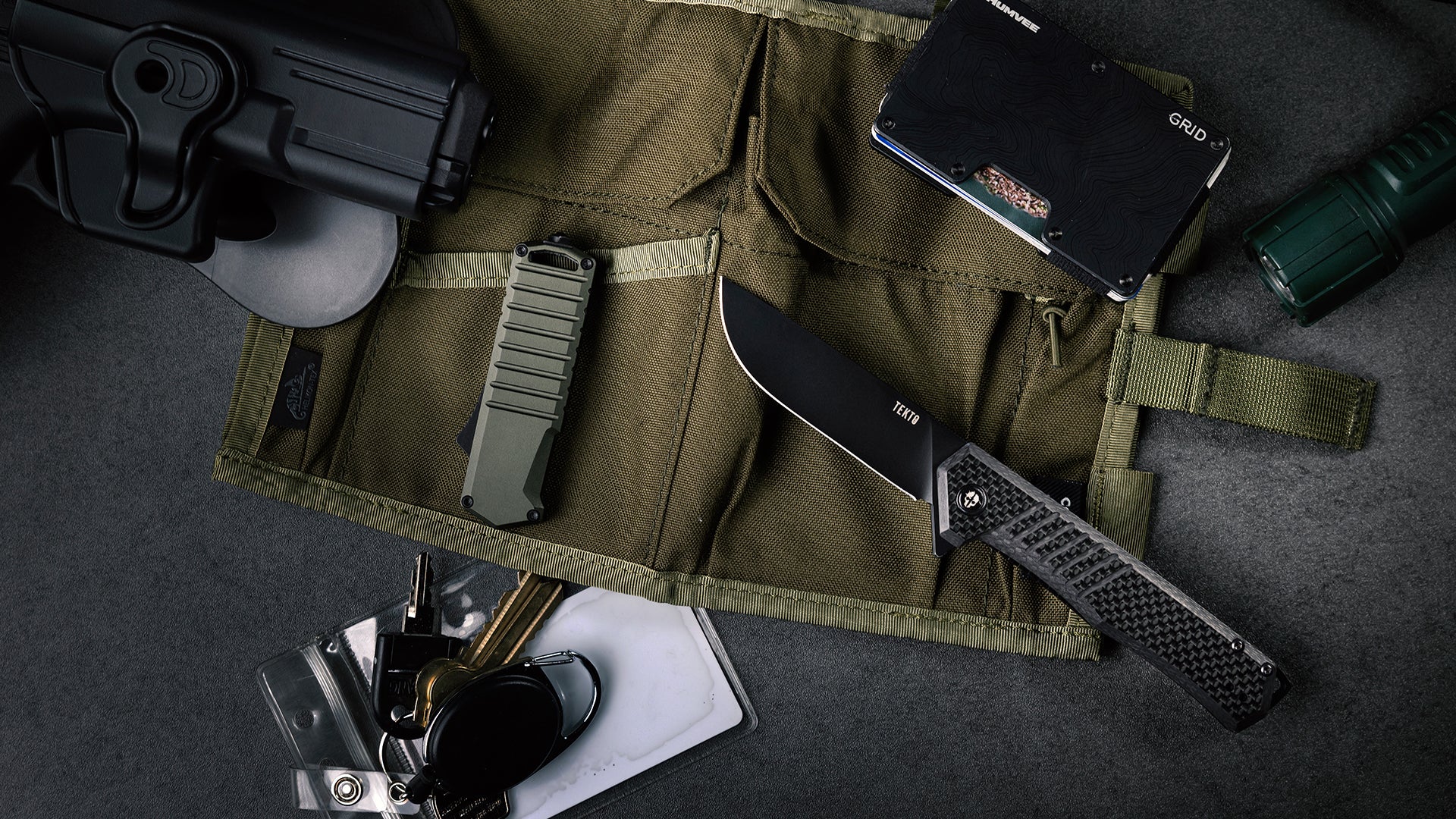 TEKTO knives laid out with everyday carry gear