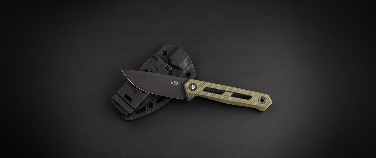 TEKTO X1 Atlas fixed blade with an OD green handle next to its sheath