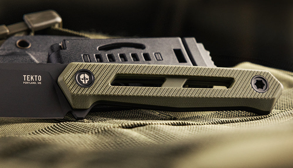 TEKTO X1 Atlas fixed blade with an OD green G10 handle on green fabric